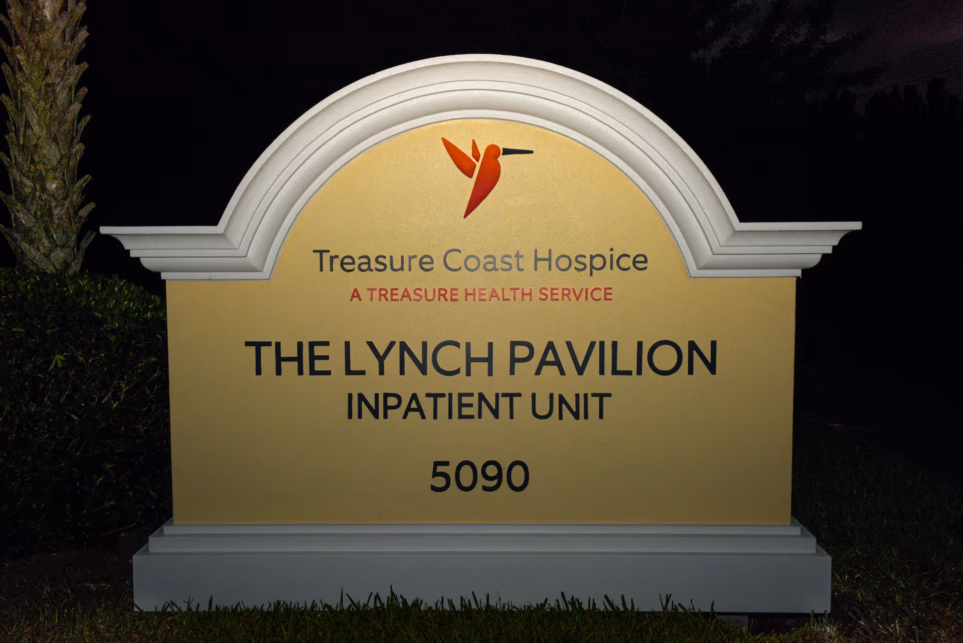 Nighttime view of the Treasure Coast Hospice sign for The Lynch Pavilion Inpatient Unit.