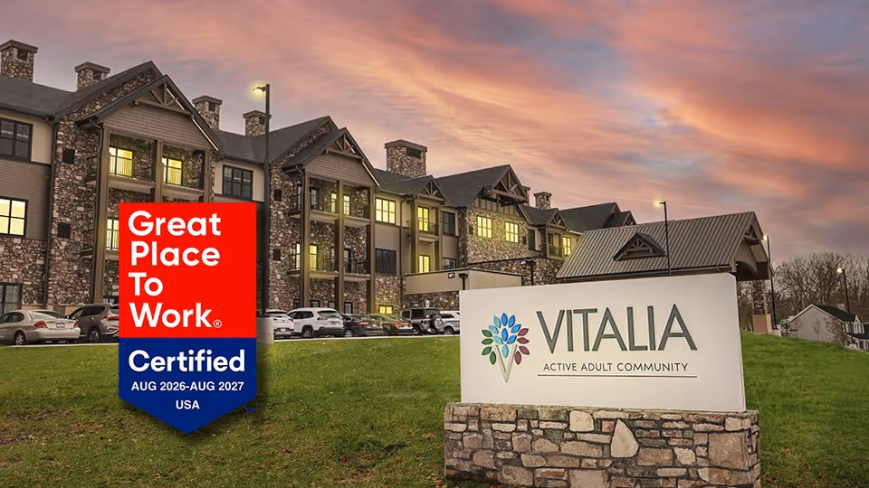 Exterior view of Vitalia Active Adult Community North Royalton with signage and Work certification badge.