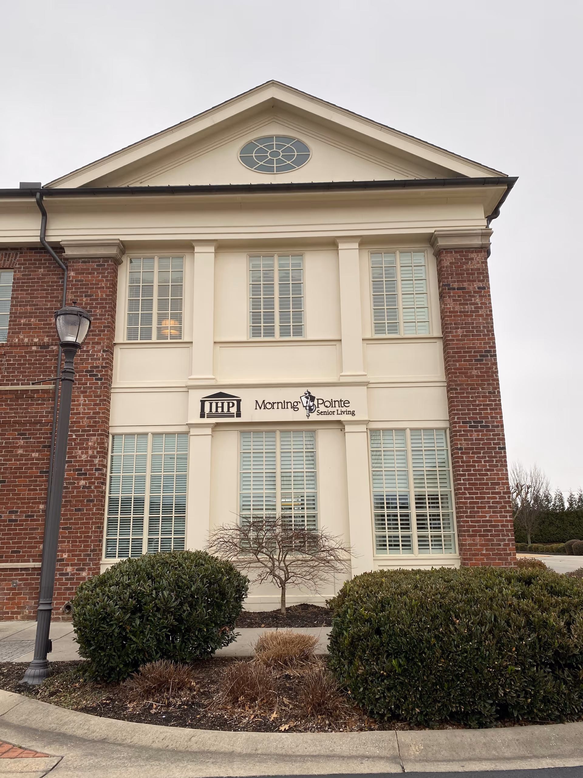 Front exterior of Morning Pointe Senior Living Corporate Office building with signage.