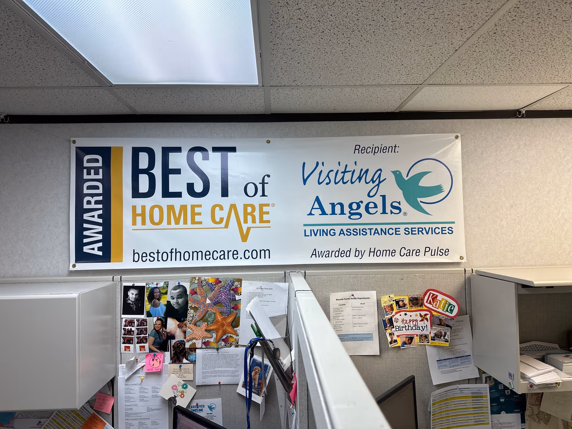 Banner for Best of Home Care and Visiting Angels in an office cubicle.