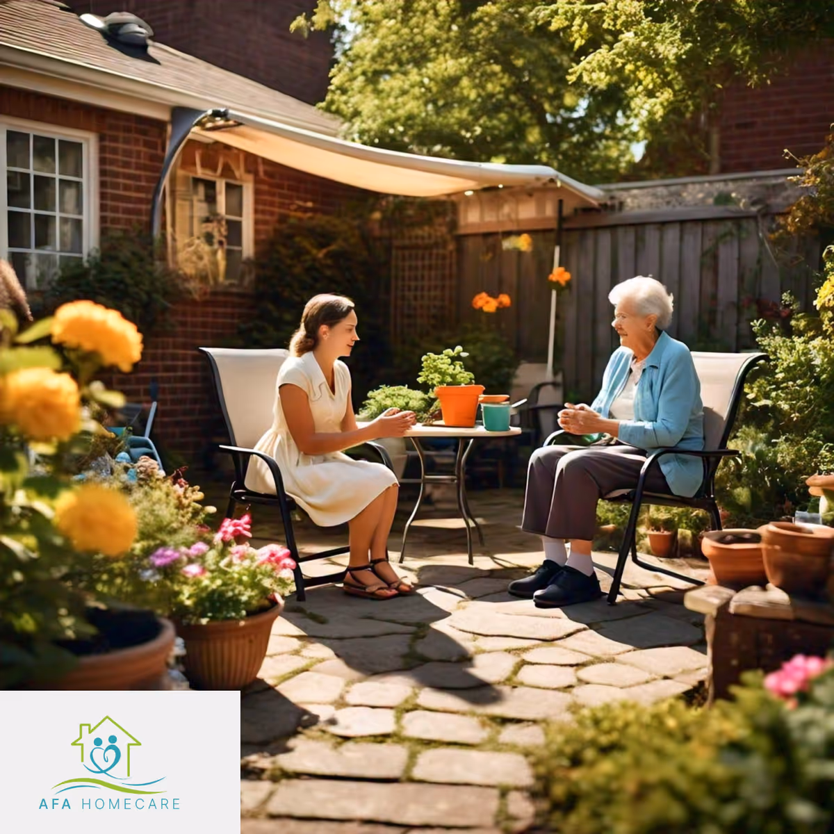A caregiver and an elderly woman chat on a sunny outdoor patio with potted plants.