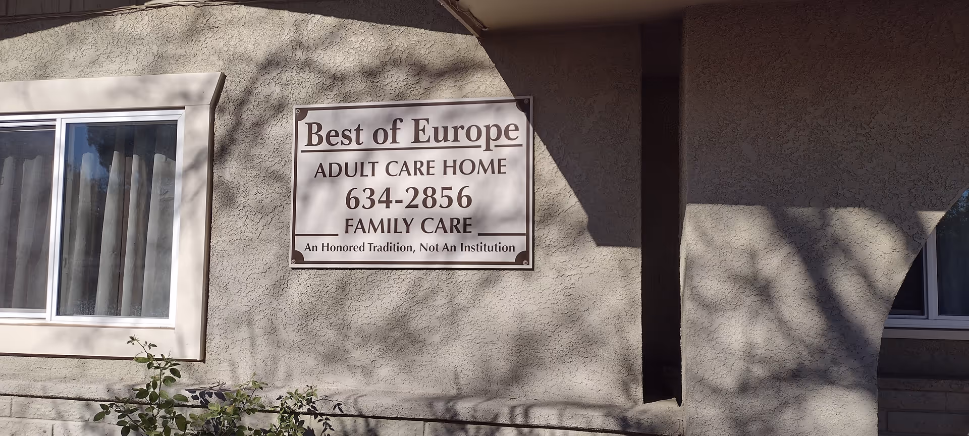 Exterior of a building with a sign reading Best of Europe Adult Care Home.