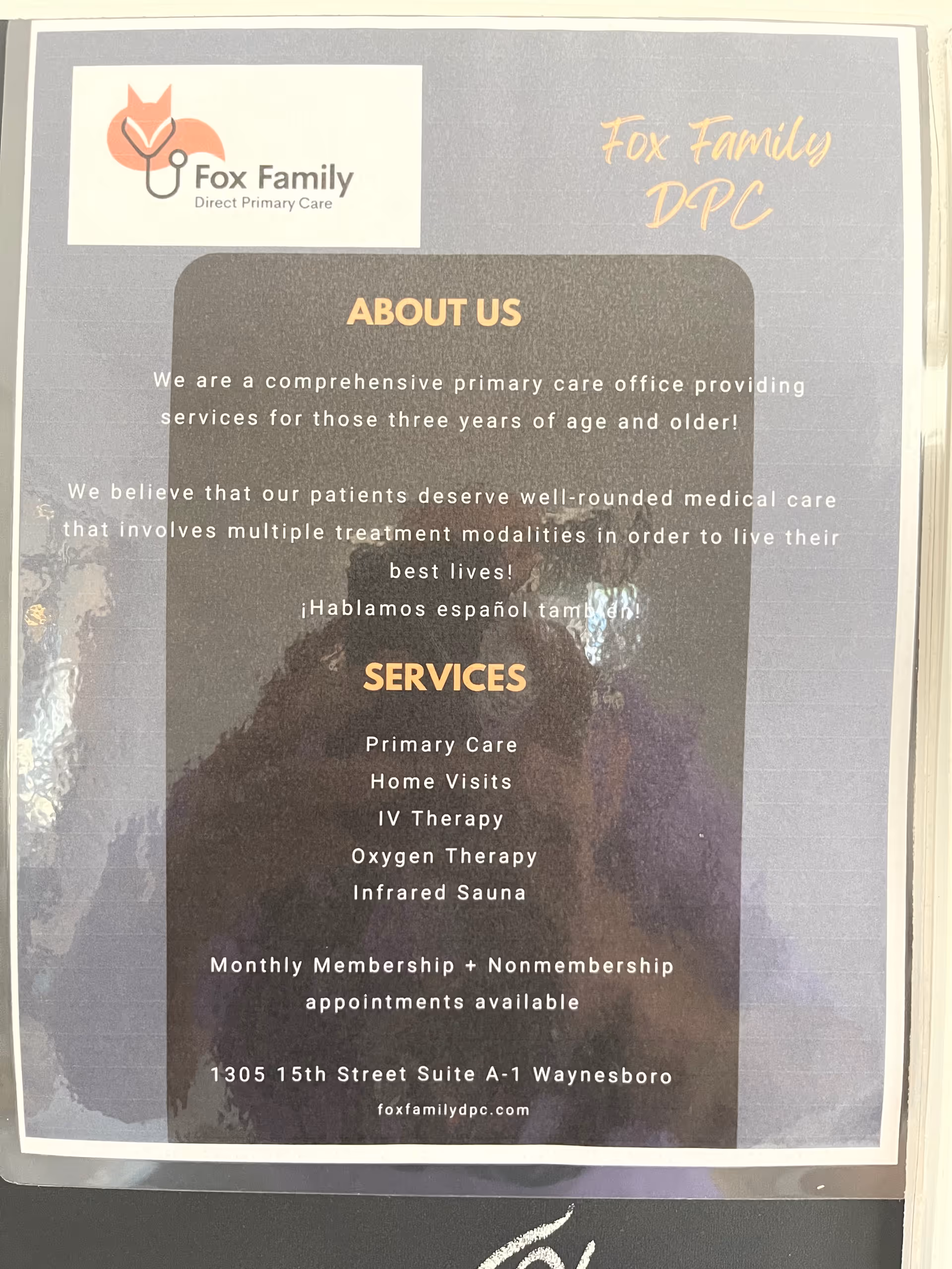 Poster on a wall advertising Fox Family Direct Primary Care services and contact information.