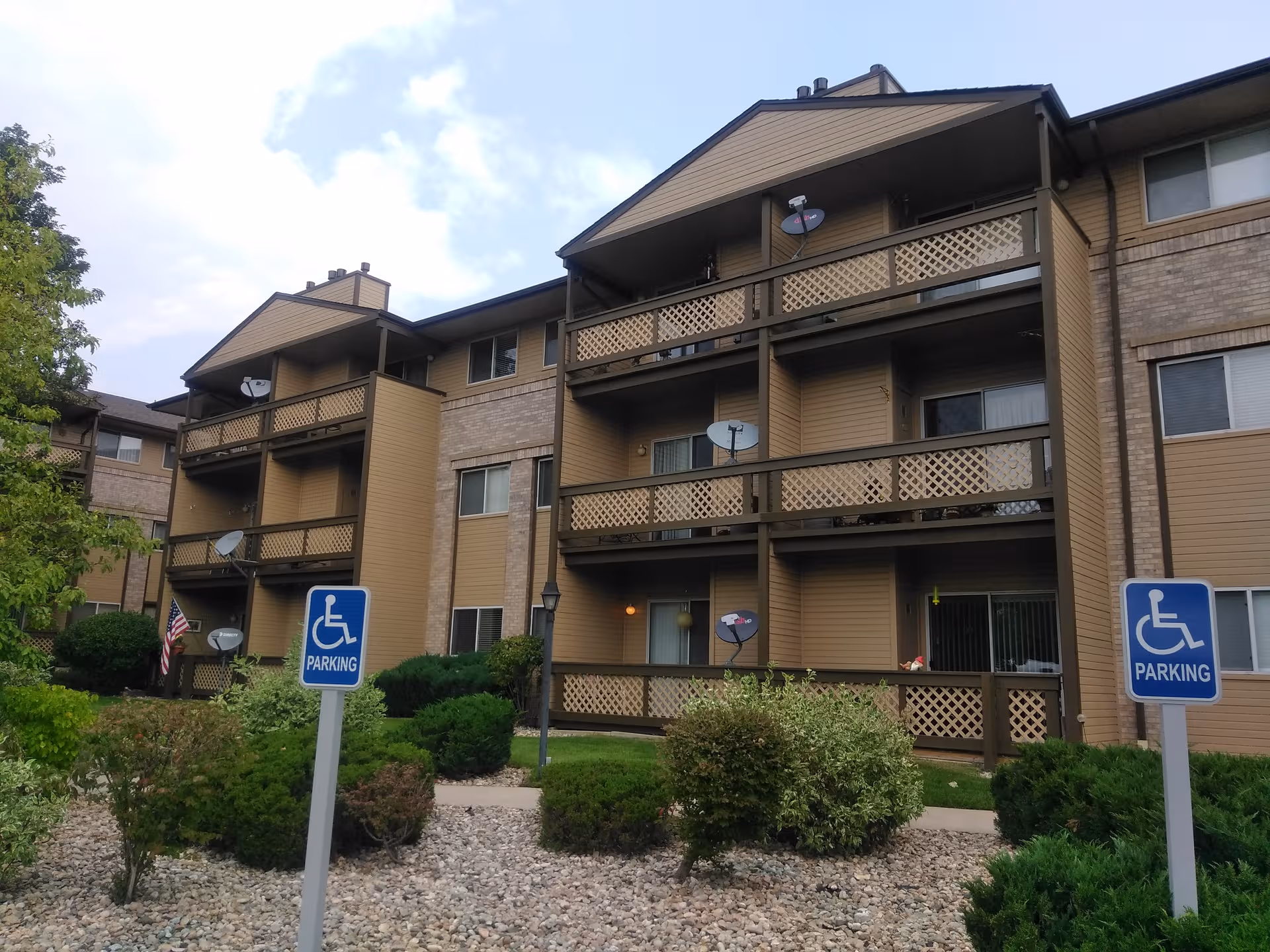 Exterior view of Brookdale Meridian Arvada senior living building with multiple balconies.