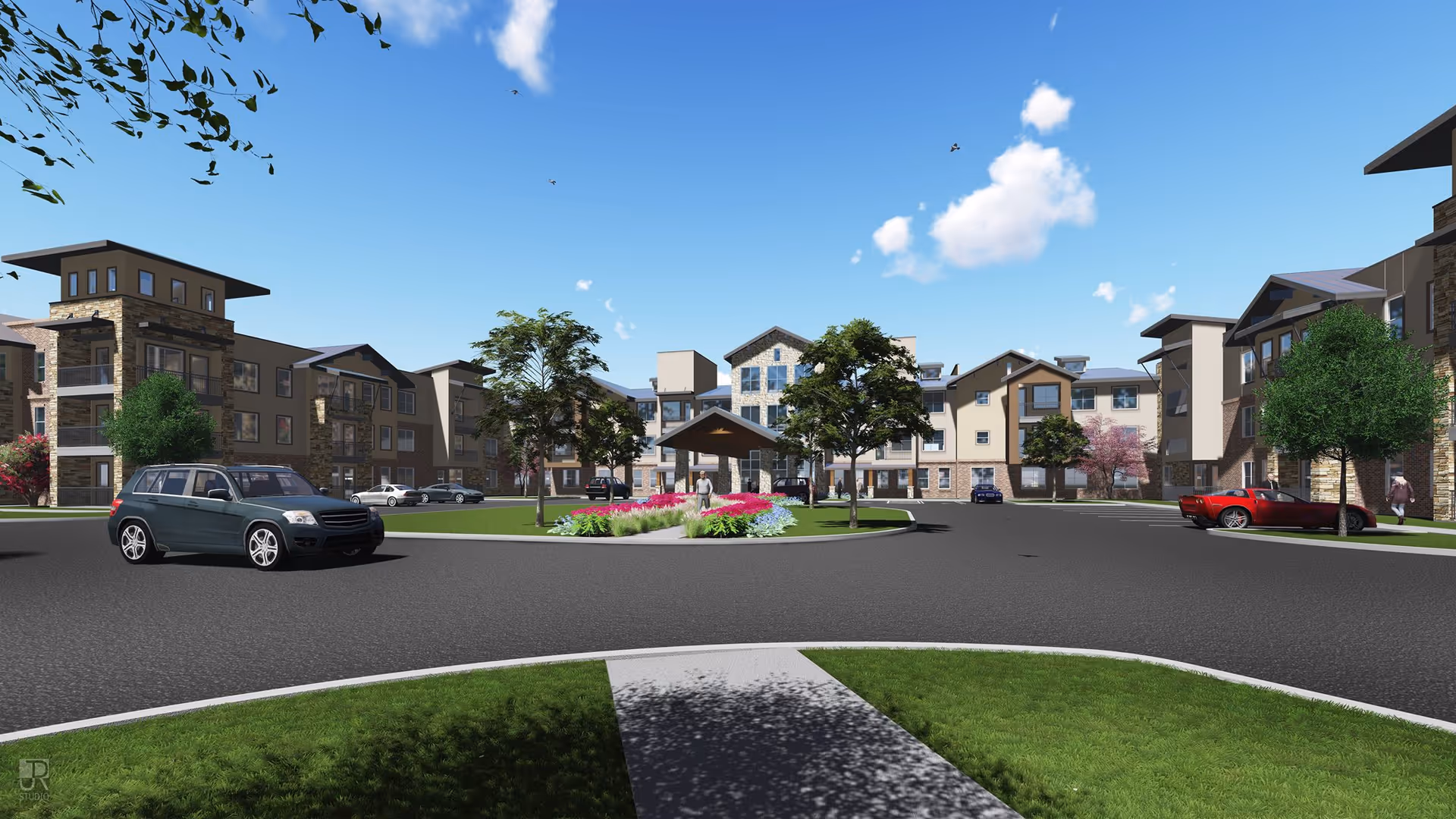 Exterior view of Watermere at Flower Mound senior living facility showing a circular driveway with landscaped center island, multiple parked cars, and multi-story residential buildings under a clear blue sky.