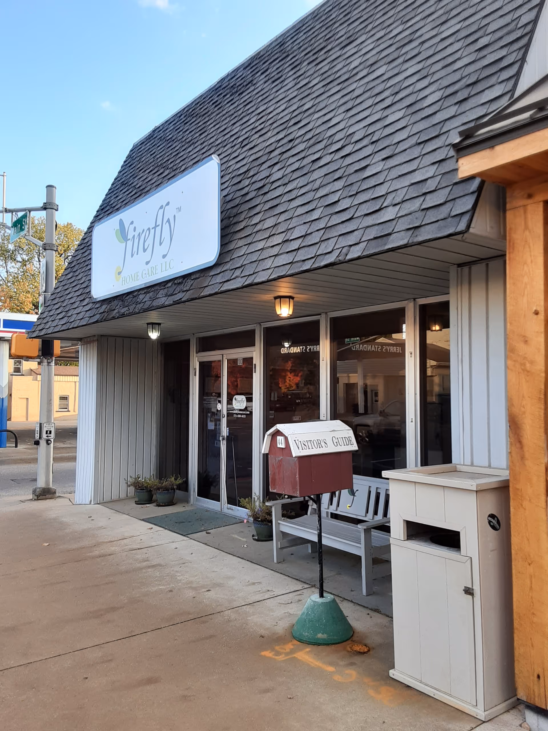 Front exterior storefront with Firefly Home Care LLC sign and entrance.