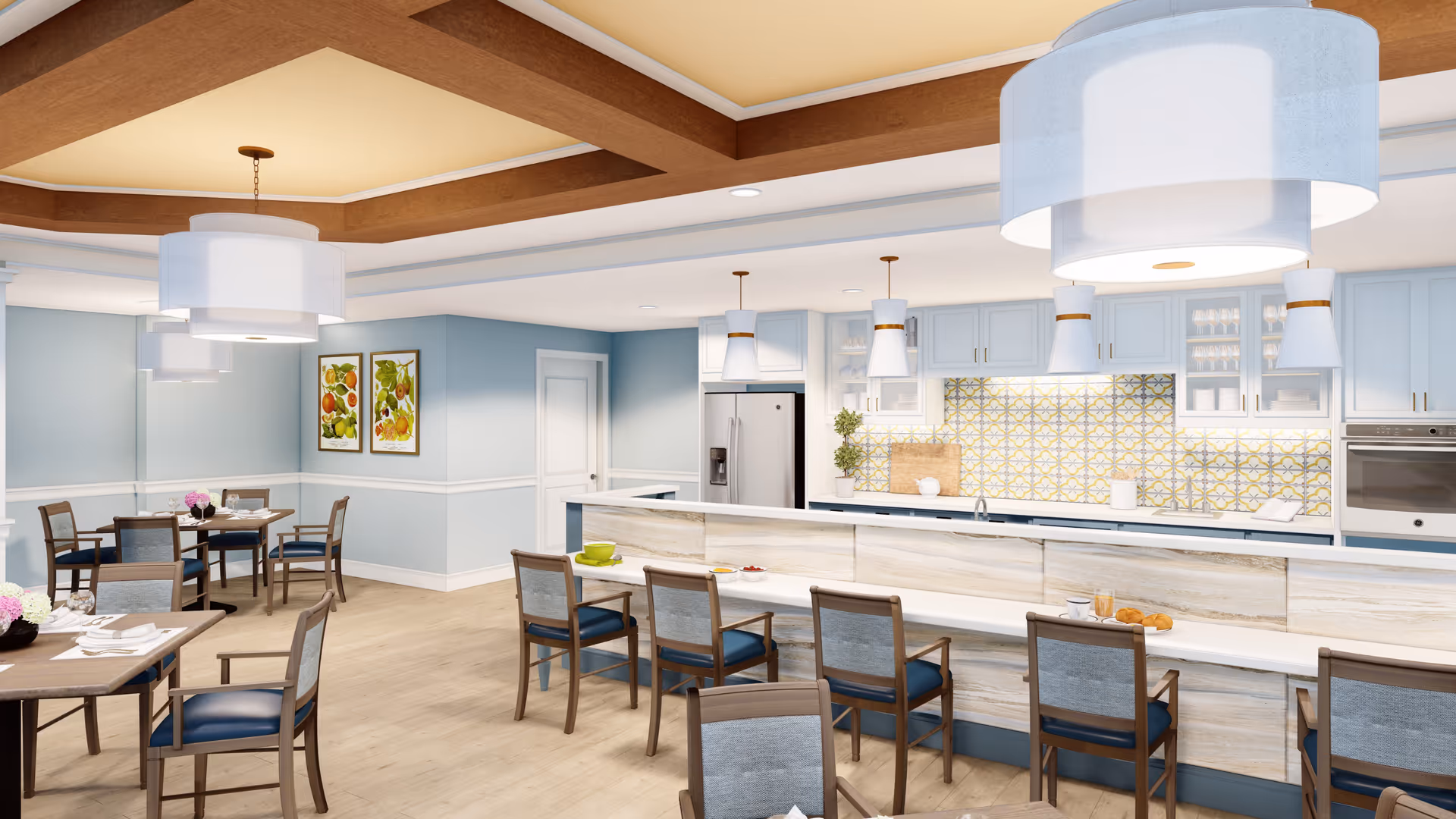 Bright communal dining and kitchen area with pastel walls and a long serving counter.