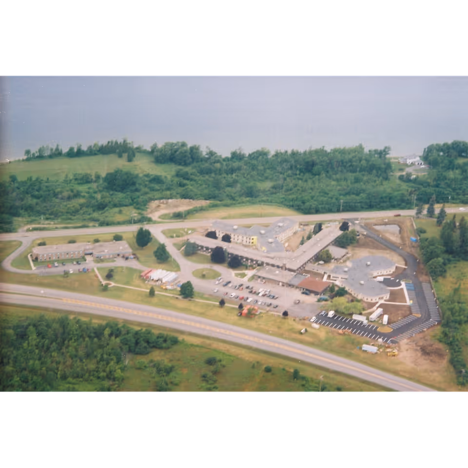 Aerial view of RiverLedge Nursing Home campus with interconnected buildings and parking.