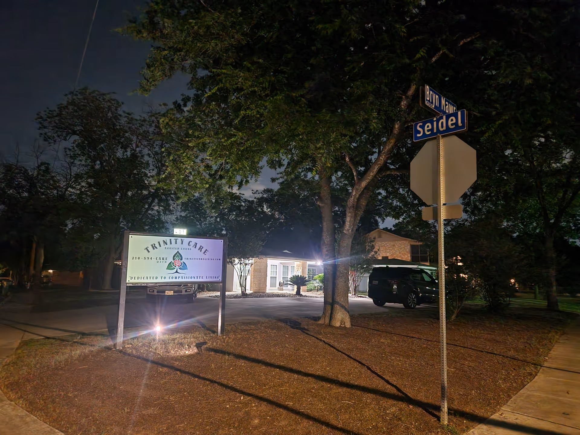Night exterior view of Starlight Homes facility with illuminated entrance sign