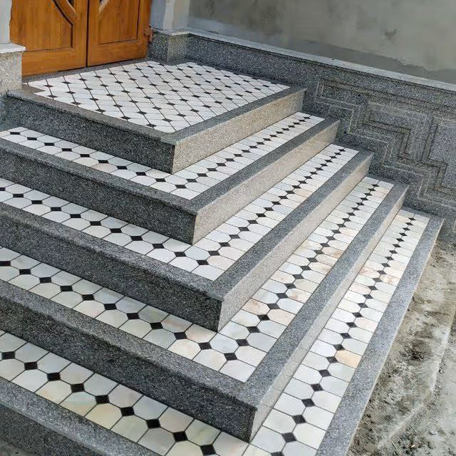 Exterior tiled steps and a wooden front door lead to the facility entrance.