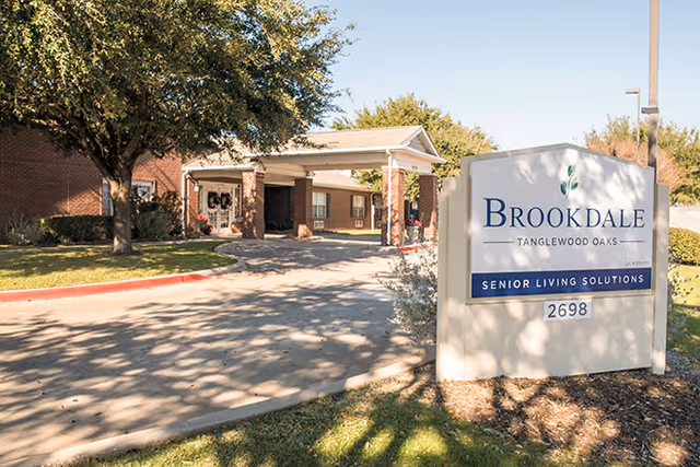 Brookdale Tanglewood Oaks senior living entrance with a prominent front sign and driveway.