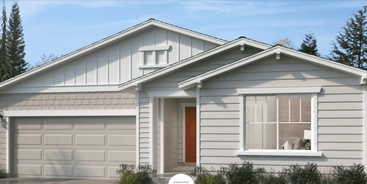 Front view of a single-story gray house-like building with a two-car garage.