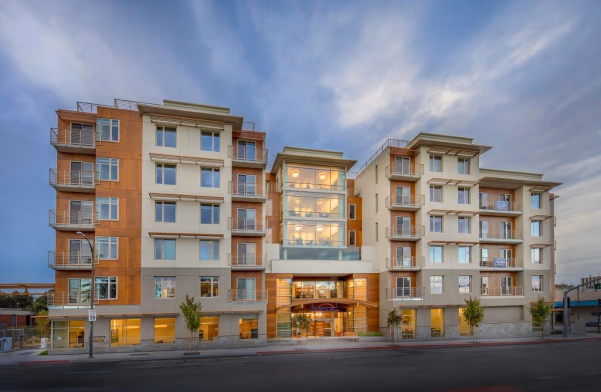 The Trousdale's modern multi-story exterior with glass entrance and balconies.