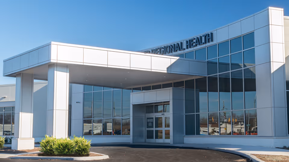 Modern RRH Henrietta Medical Campus building with glass facade and a large covered entrance.