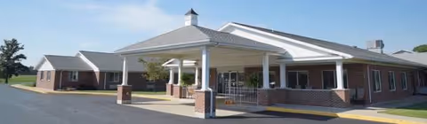 Exterior view of Hilty Memorial Home with brick walls and covered entrance