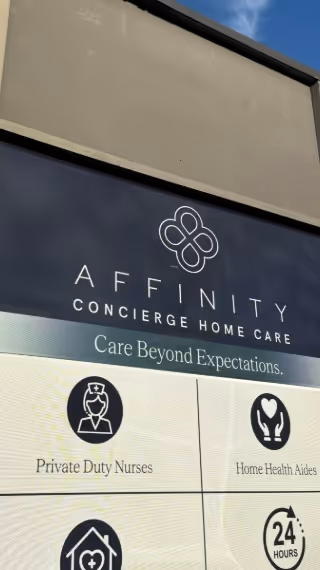 Exterior sign for Affinity Concierge Home Care with logos and tagline.