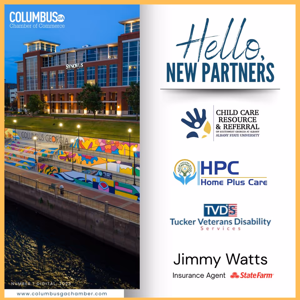 Exterior view of a modern riverfront building with a colorful mural and logos.