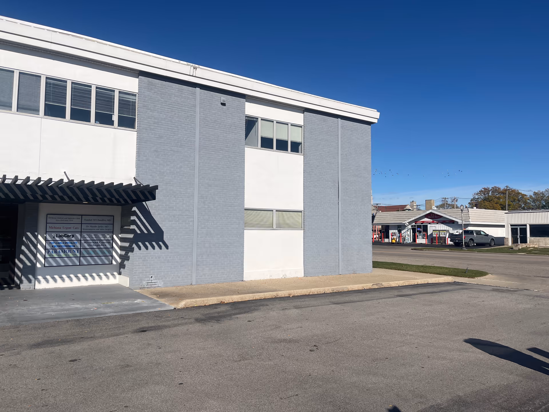Exterior view of Soothing Souls Home Care facility, a grey and white building.