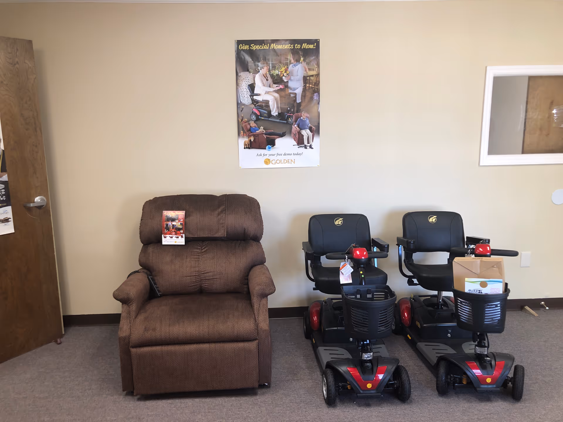 Interior lounge showing a brown recliner and two mobility scooters.