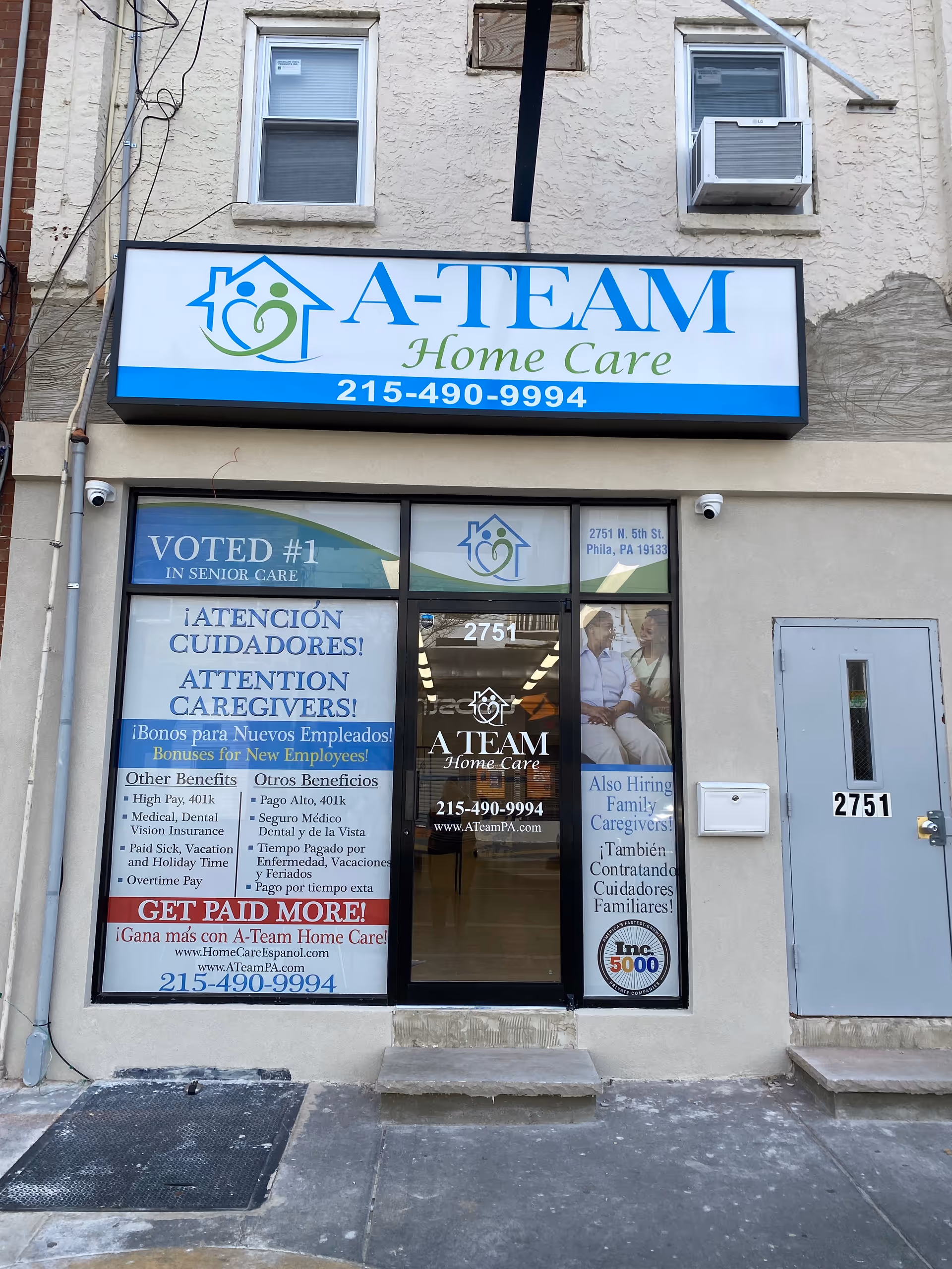 Front of A-Team Home Care Philadelphia storefront with signage and posters.