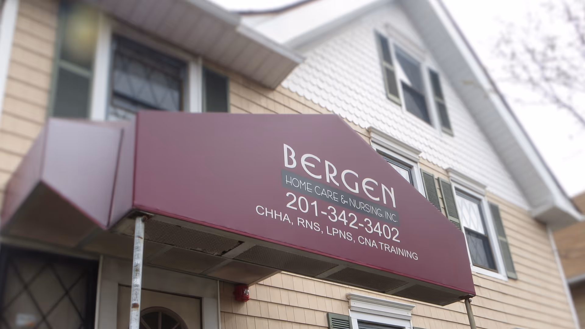 Exterior view of Bergen Home Care and Nursing building with maroon awning sign.