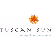 Front sign for Tuscan Sun Massage and Wellness with a sunflower logo.