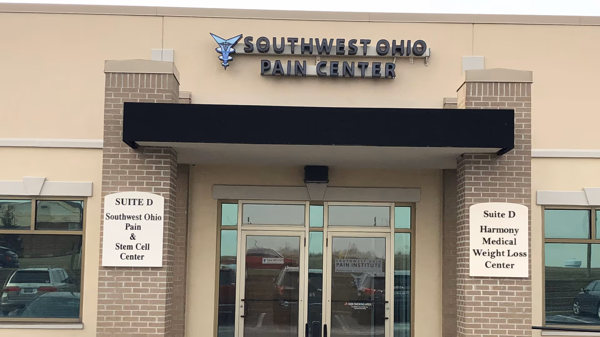 Front of a beige medical office building with Southwest Ohio Pain Center sign