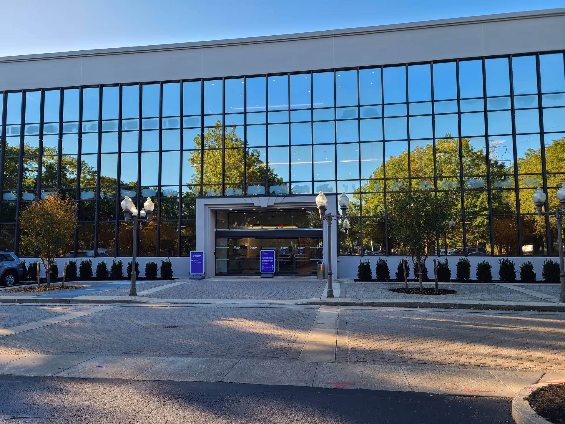 Glass-front NYU Langone Ambulatory Care Bethpage building exterior with entrance.
