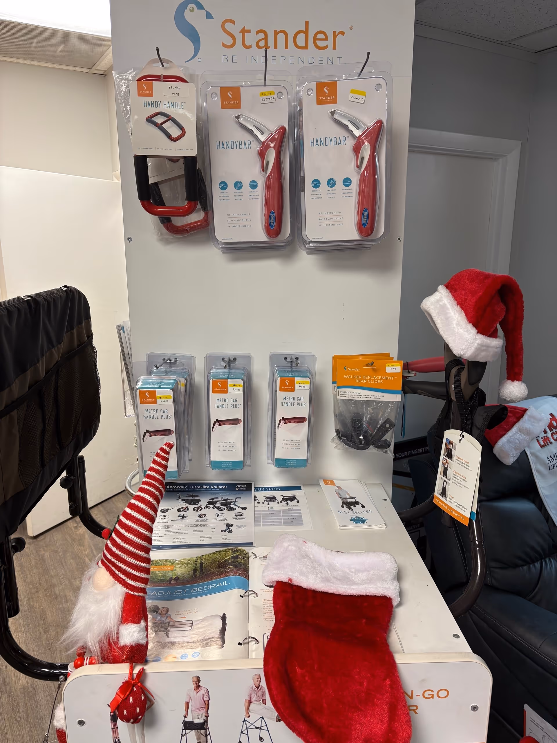 Indoor PHC Health display of assistive devices with Santa hat decorations.