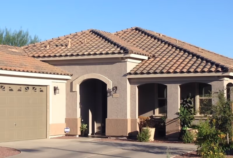 Front view of Mountain View Care Home with a tiled roof and arched entry.