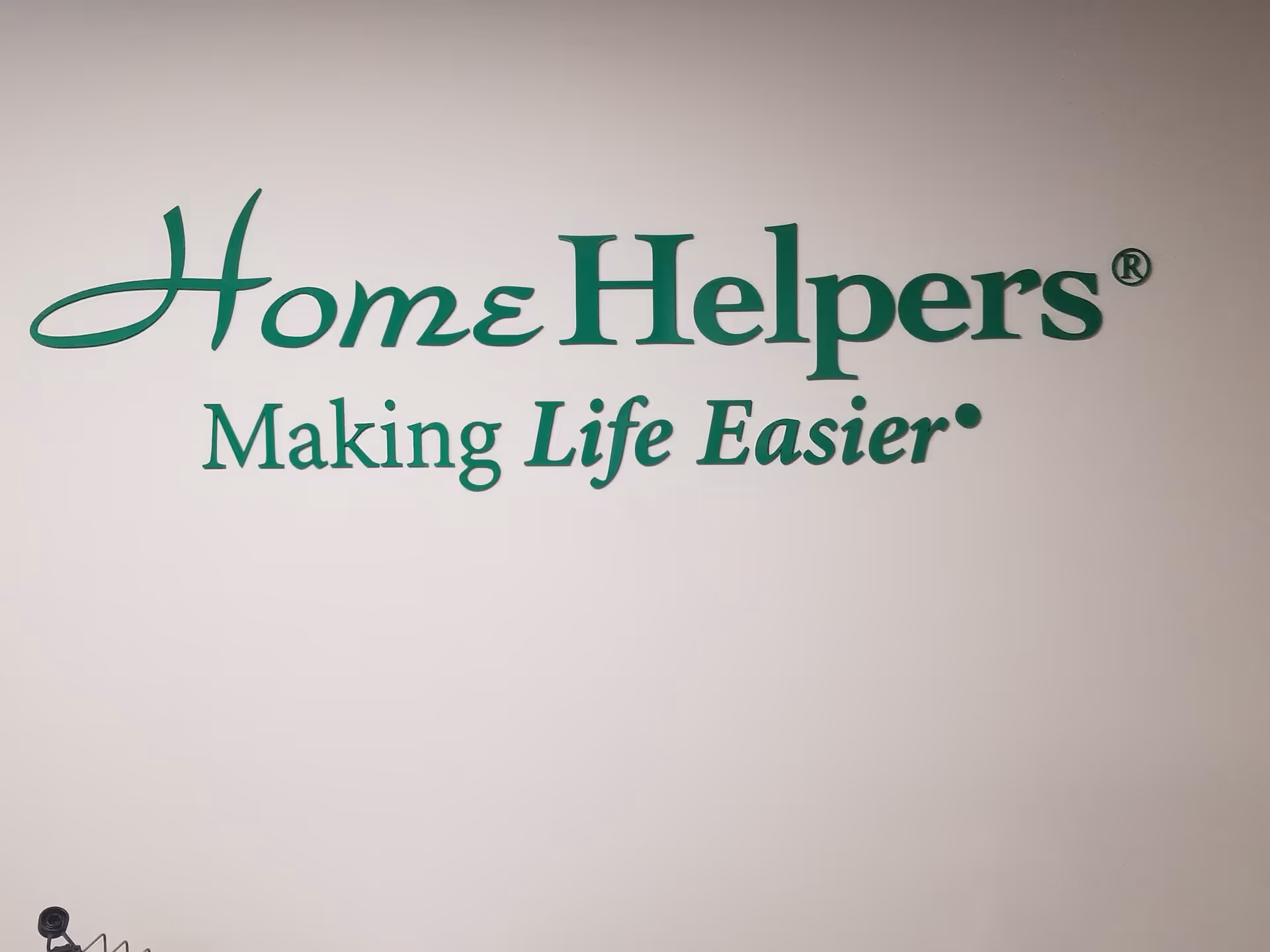 Interior wall featuring Home Helpers logo and slogan 'Making Life Easier'.