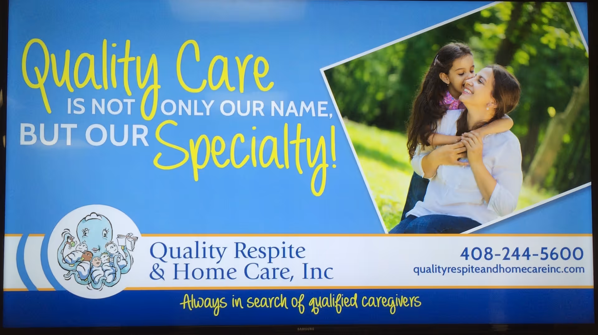Blue promotional sign for Quality Respite and Home Care with mother and child photo.
