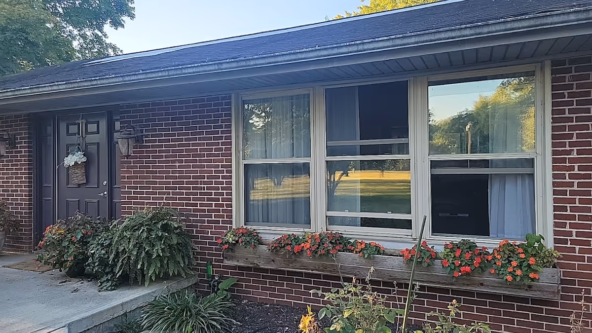 Brick Buckeye Senior Services facility exterior with flower planters and a front door.