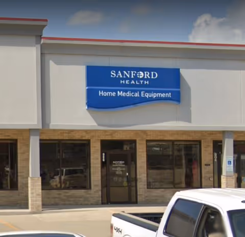Facade of Sanford Health building with blue Home Medical Equipment sign.