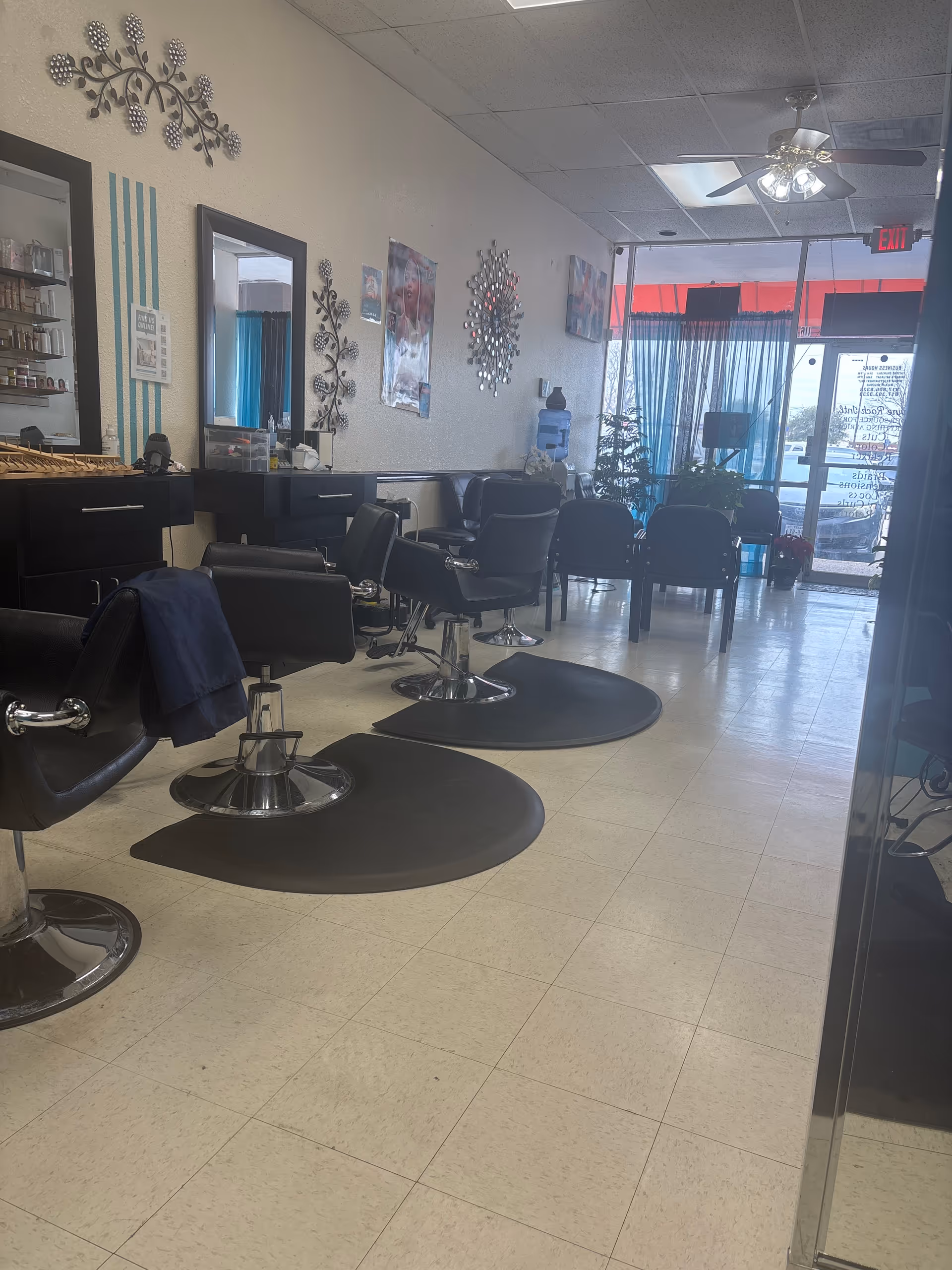 Interior view of an empty senior living facility beauty salon with styling chairs.