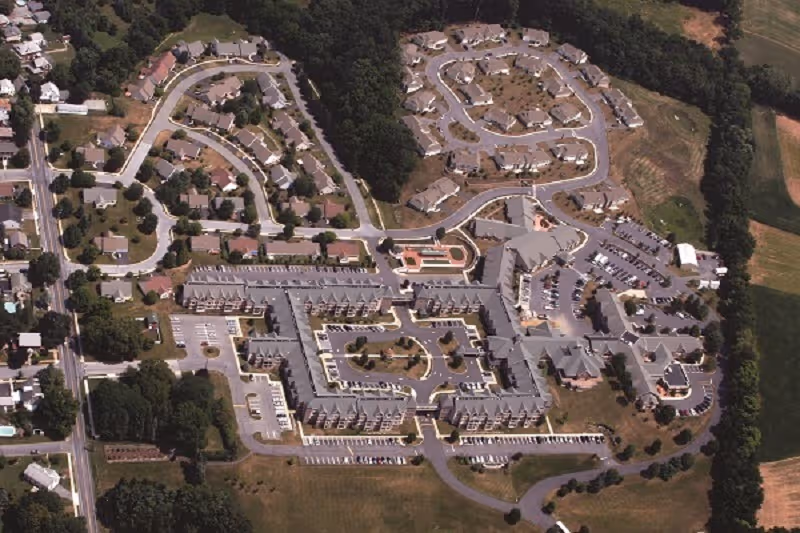 Aerial view of Phoebe Berks senior living campus showing buildings and parking.