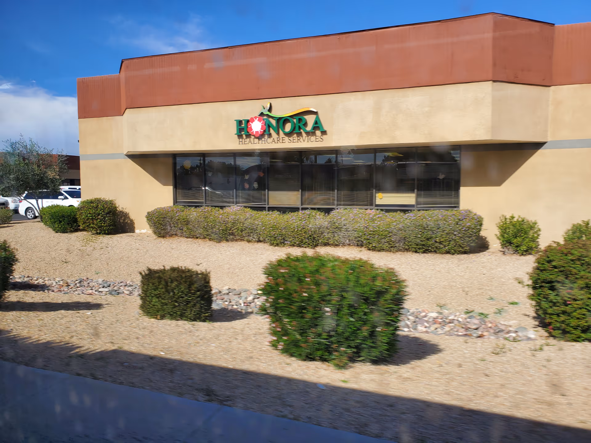 Exterior view of Honora Healthcare Services building with desert landscaping