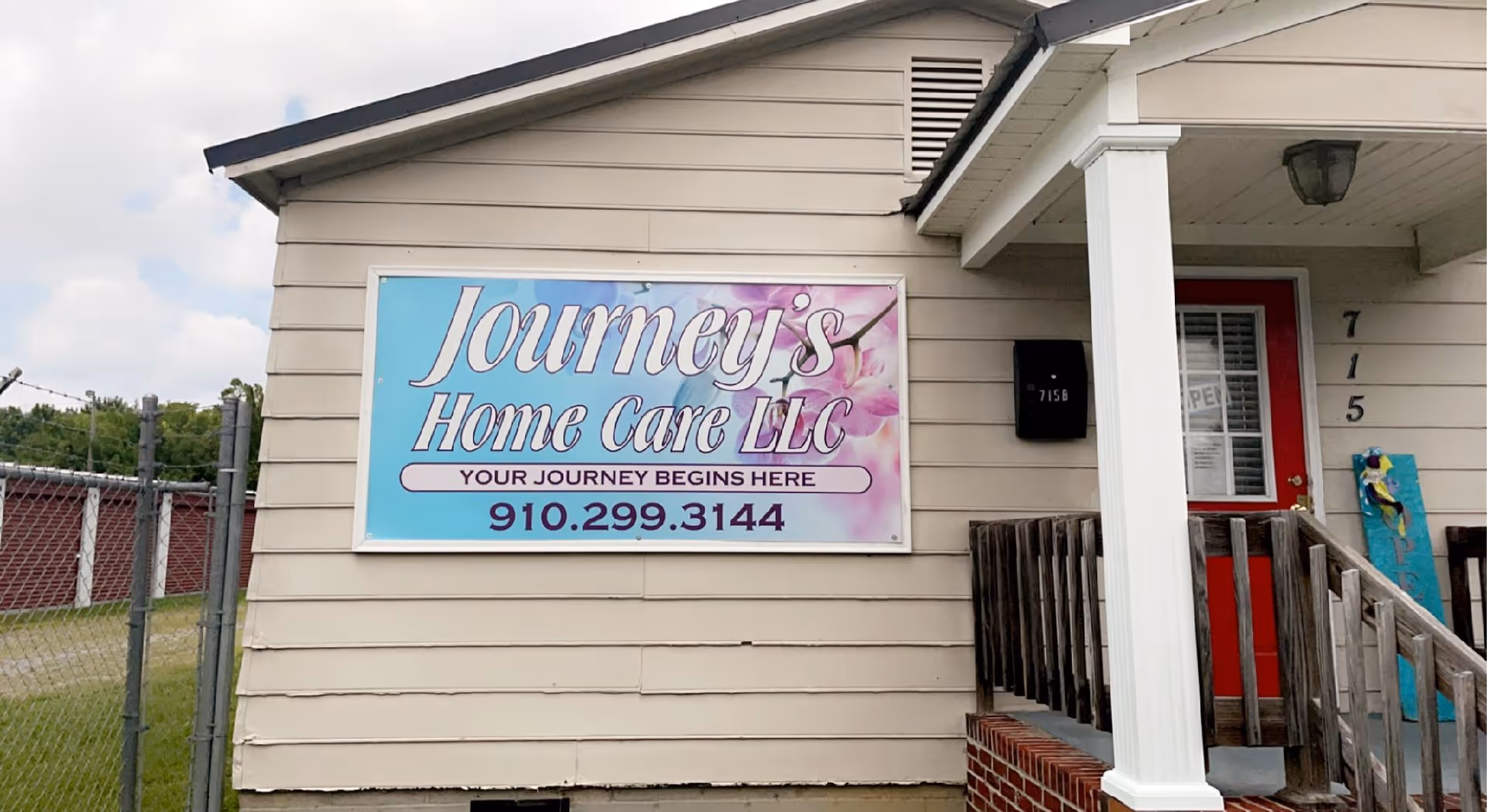 Front exterior of Journey's Home Care LLC with sign, doorway, and porch steps.