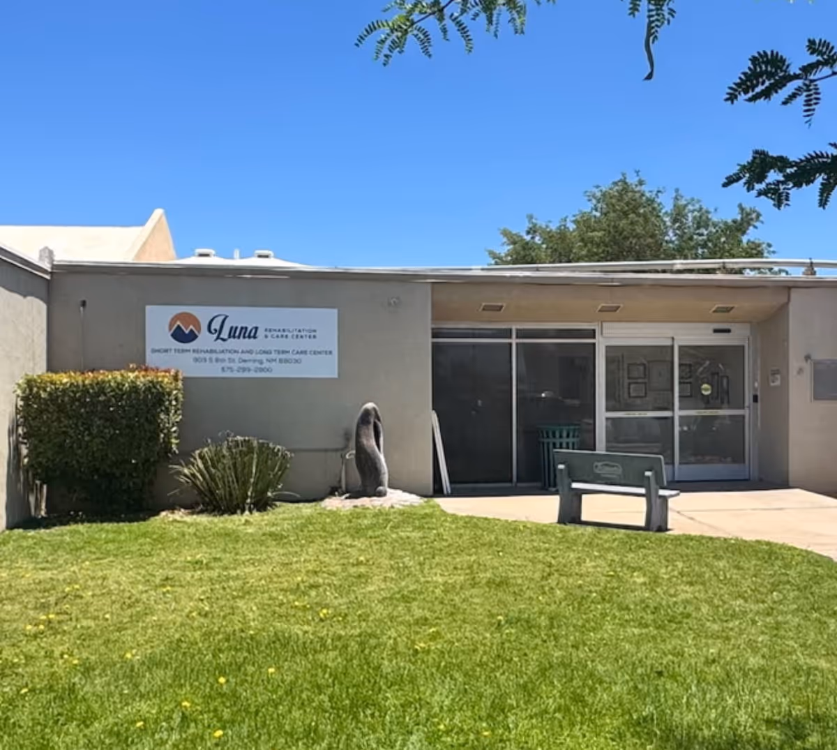Front exterior of Luna Rehabilitation and Care Center with entrance door and sign