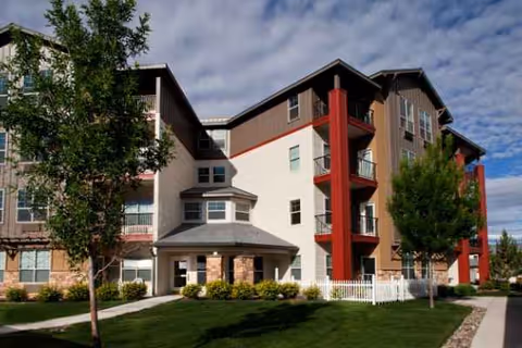 Exterior view of MorningStar Senior Living of Sparks building with trees and a walkway.