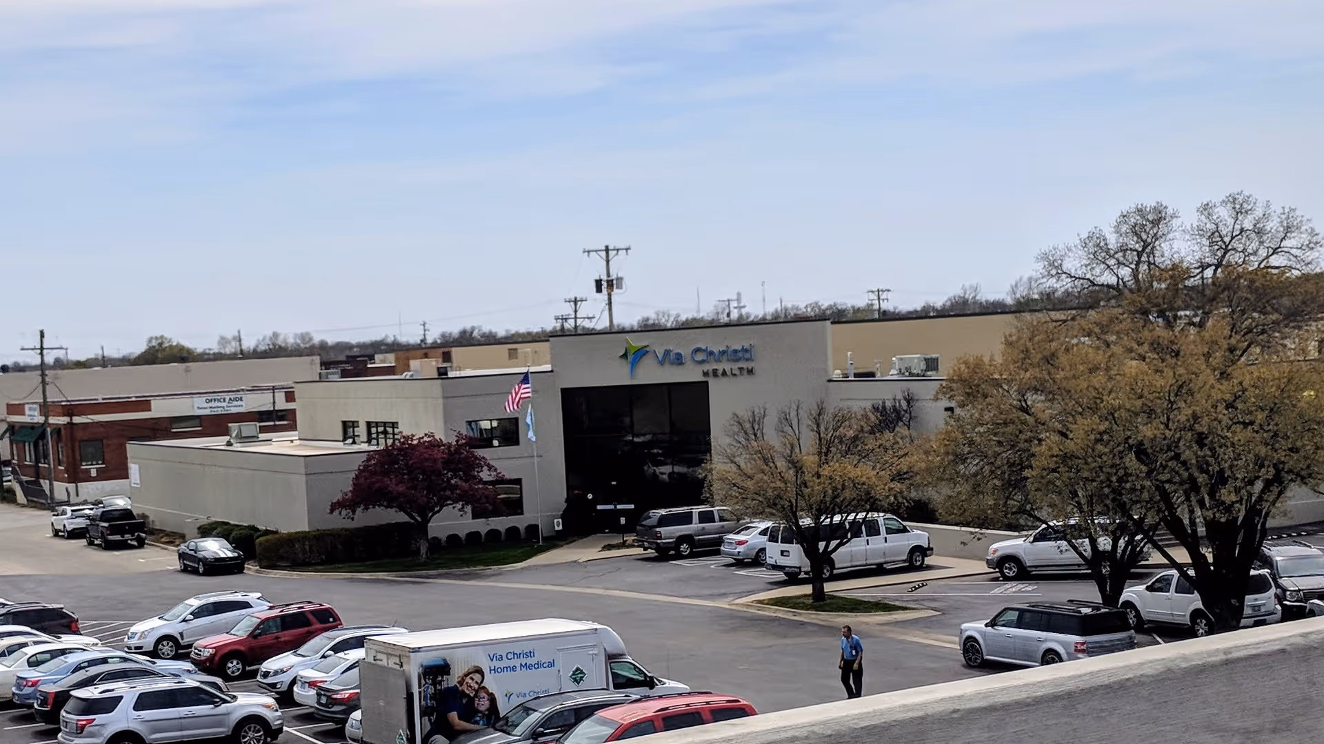 Exterior view of Ascension Via Christi Home Medical on Washington with a parking lot.