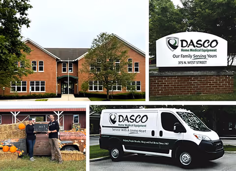 Facility exterior with DASCO sign, service van, and staff near pumpkins.