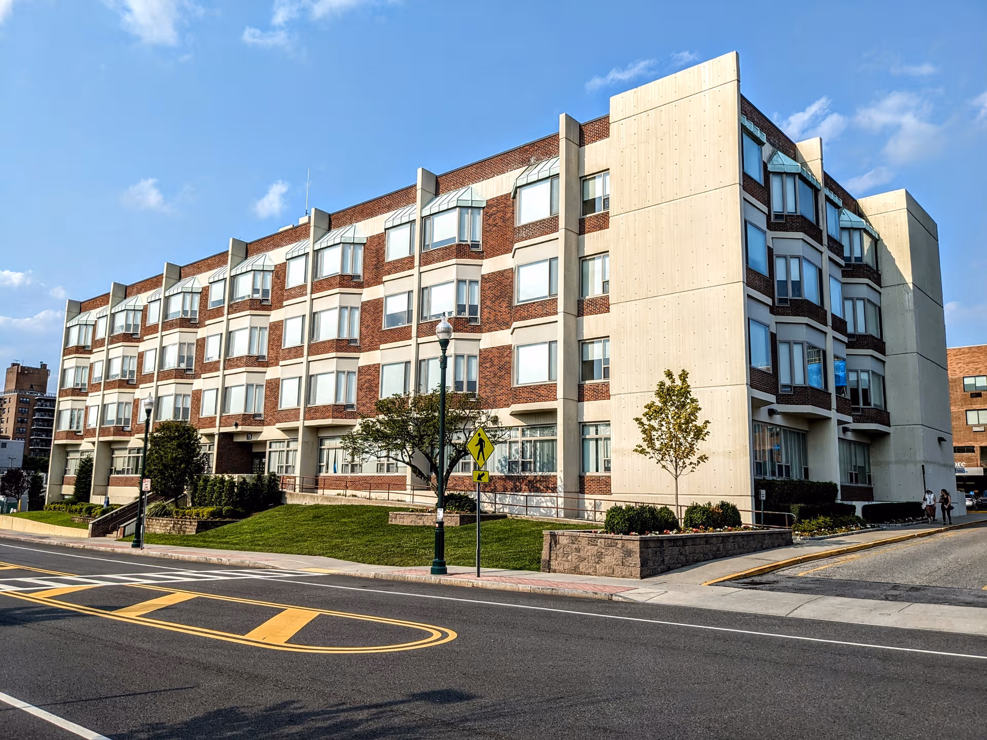 Schaffer Extended Care Center exterior, a multi-story brick building along a street.