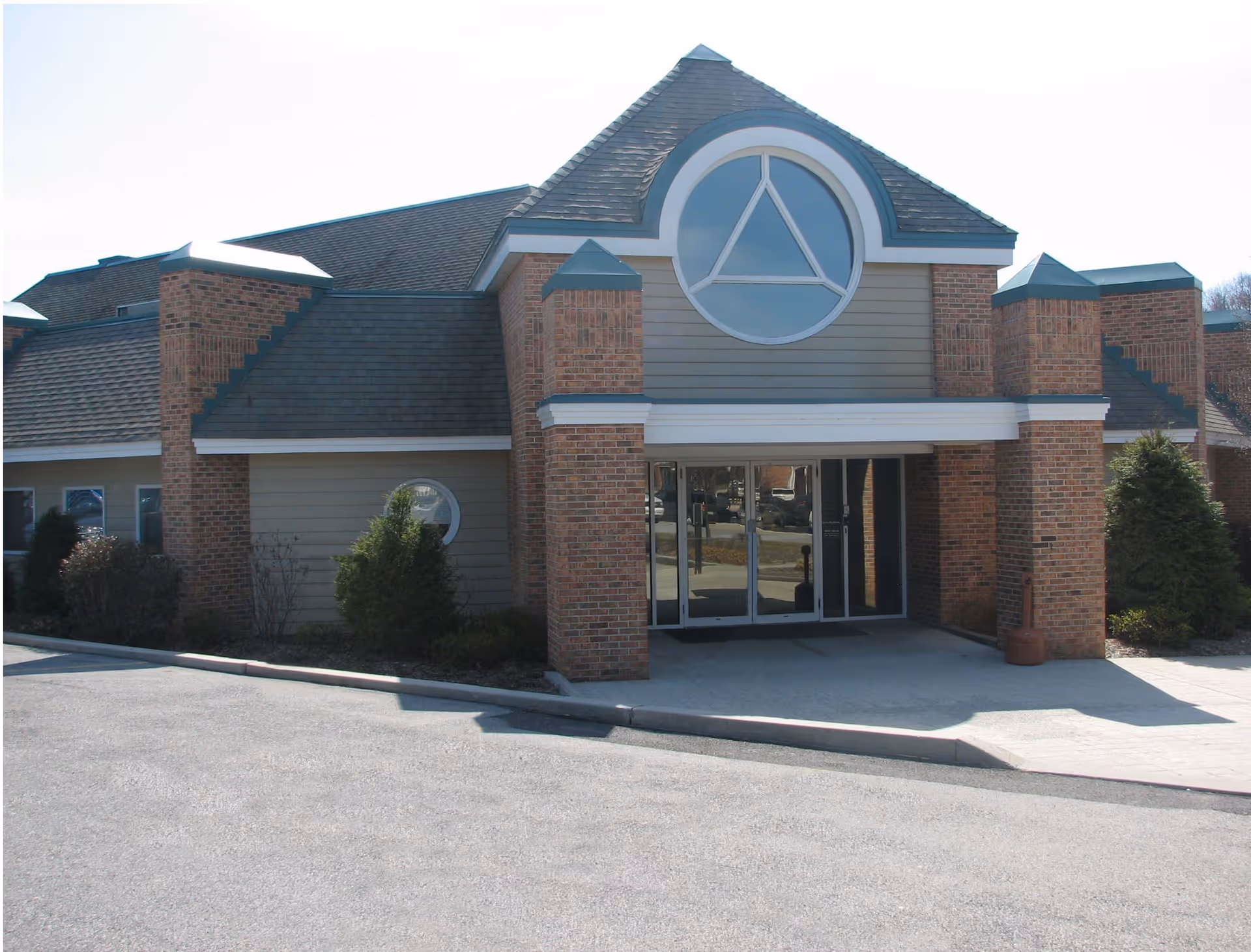 Exterior view of a Delta Health Technologies LLC senior living facility entrance.