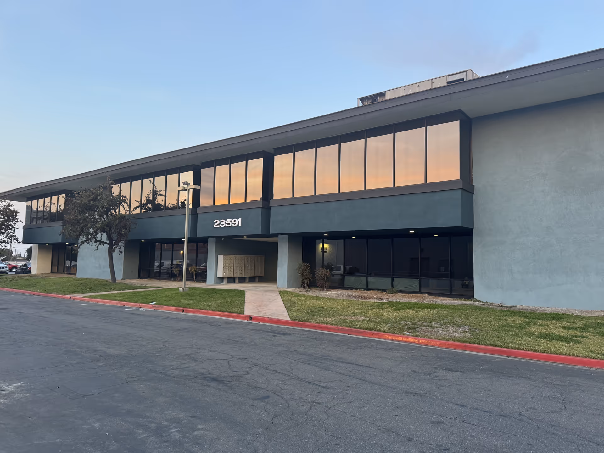 Exterior view of Griswold Home Care Laguna Hills facility with large glass windows.