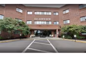Brick senior care building with Gladeview sign and entrance canopy.