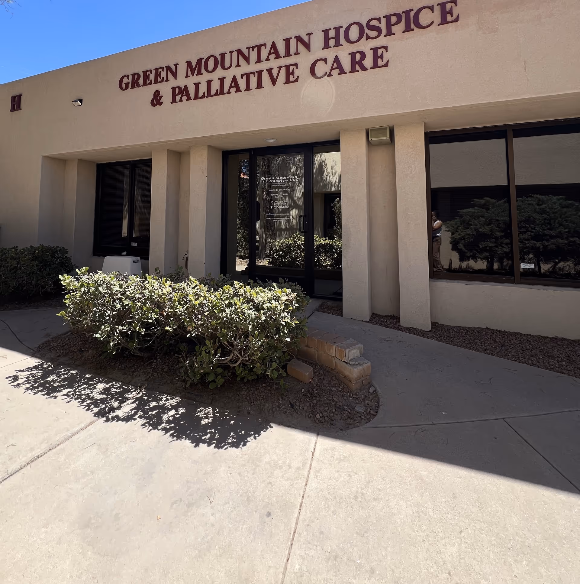 Front view of Green Mountain Hospice building with signage and entry doors.