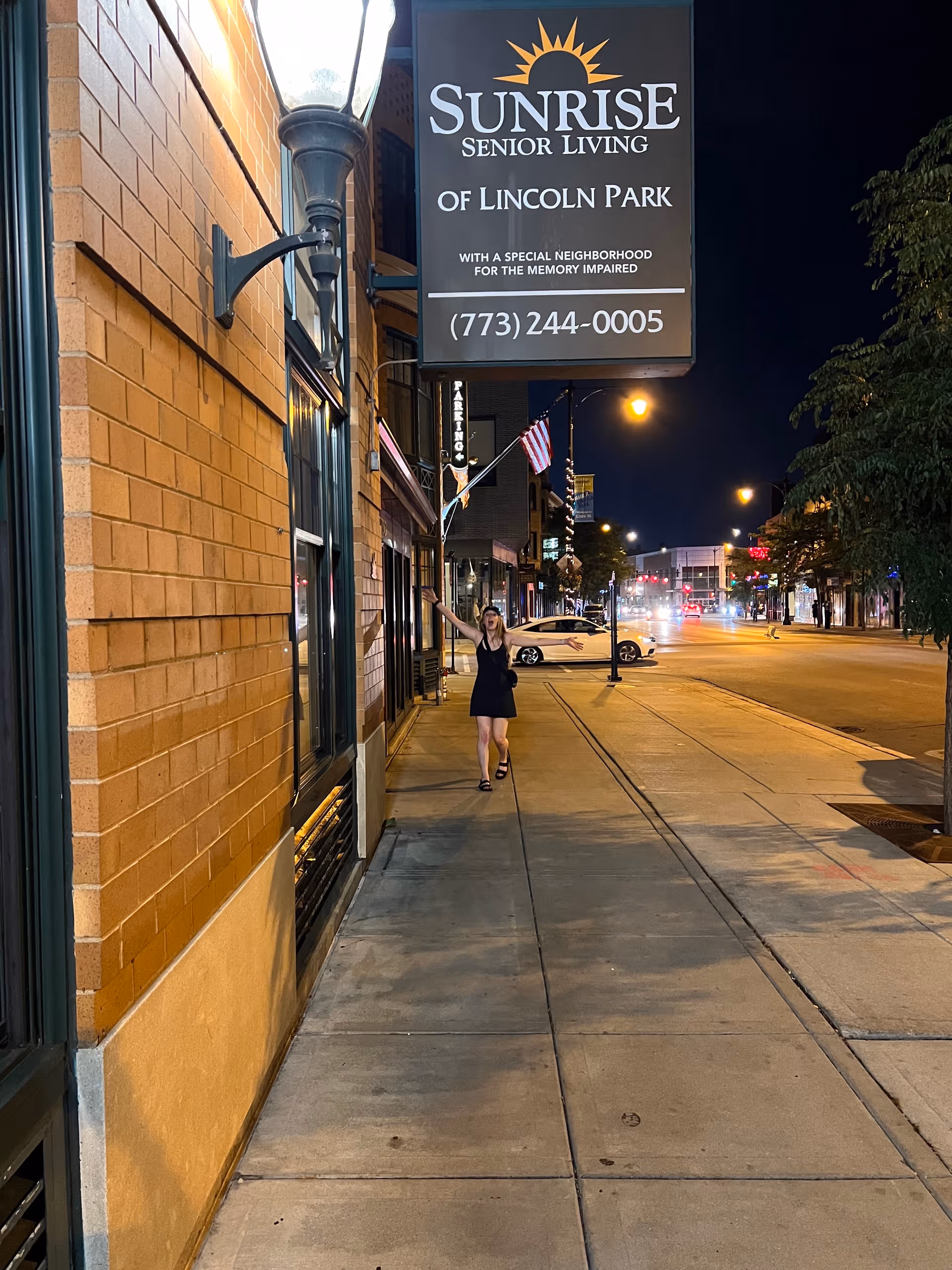 Night street view of Sunrise Senior Living of Lincoln Park exterior sign.