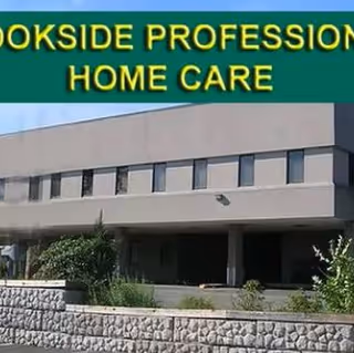 Front exterior of Brookside Professional Home Care building with sign and landscaped entrance.