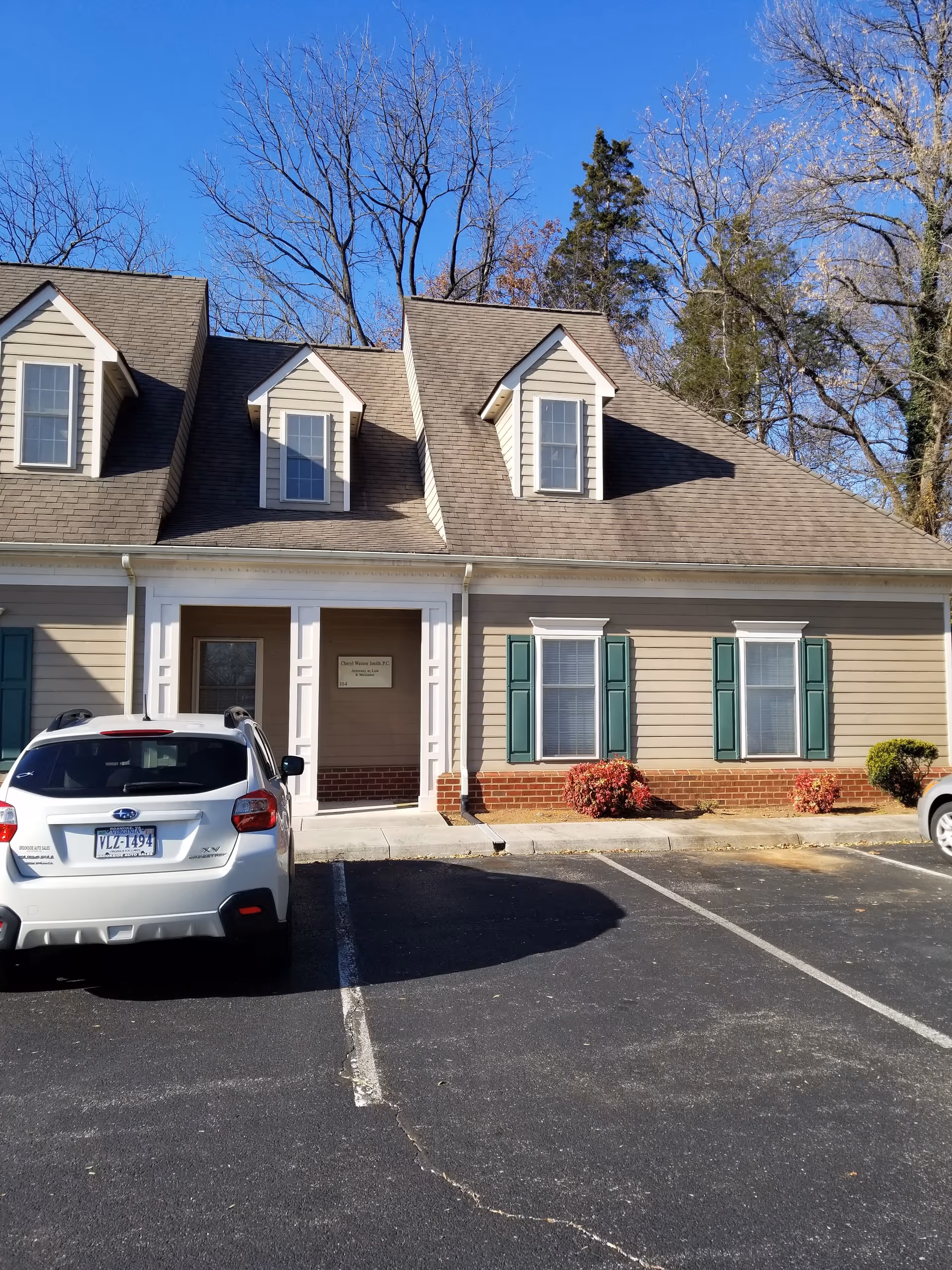 Exterior view of Richfield Living Town Center building with a parked car in front.